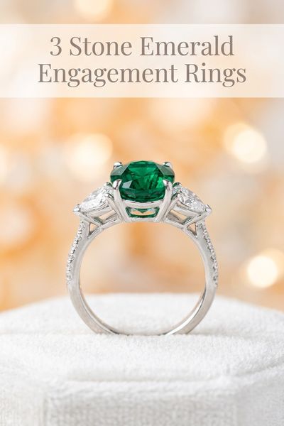3 stone emerald engagement rings