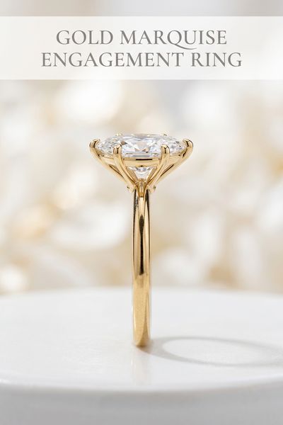gold marquise engagement ring